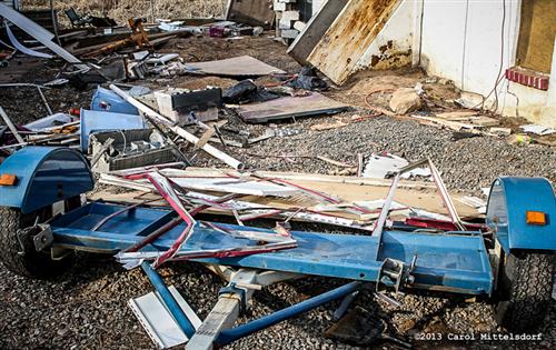 Tools and equipment thrown in the mud by asbestos abatement contractors
